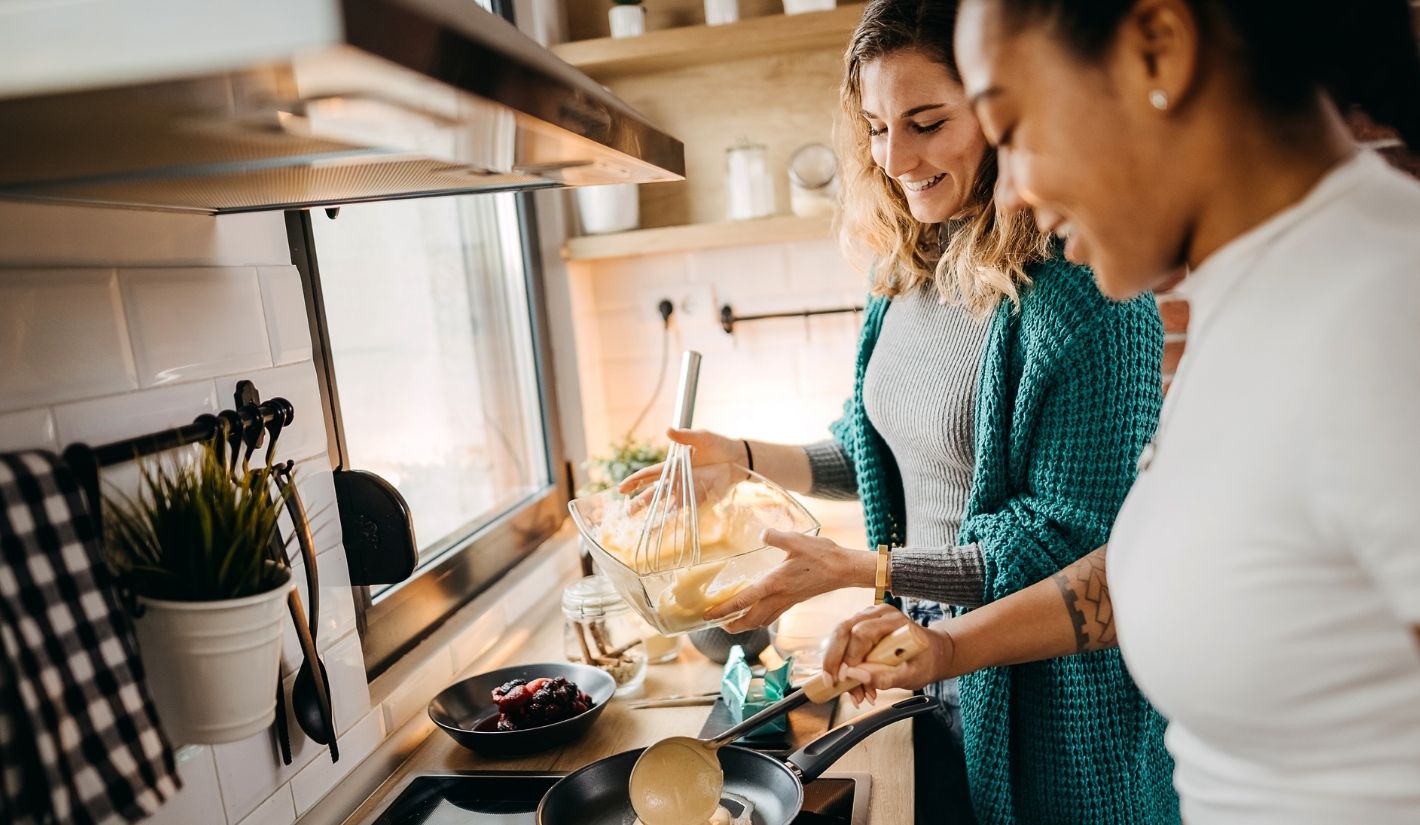 women preparing food in the kitchen